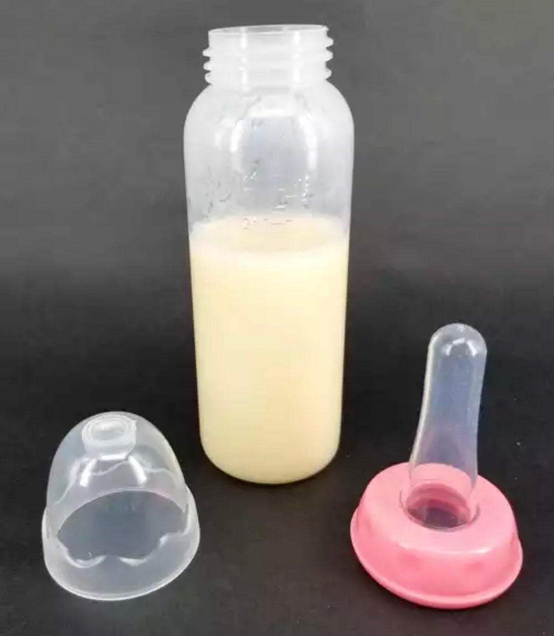 DDLGVERSE adult sized baby bottle with teat and pink cap