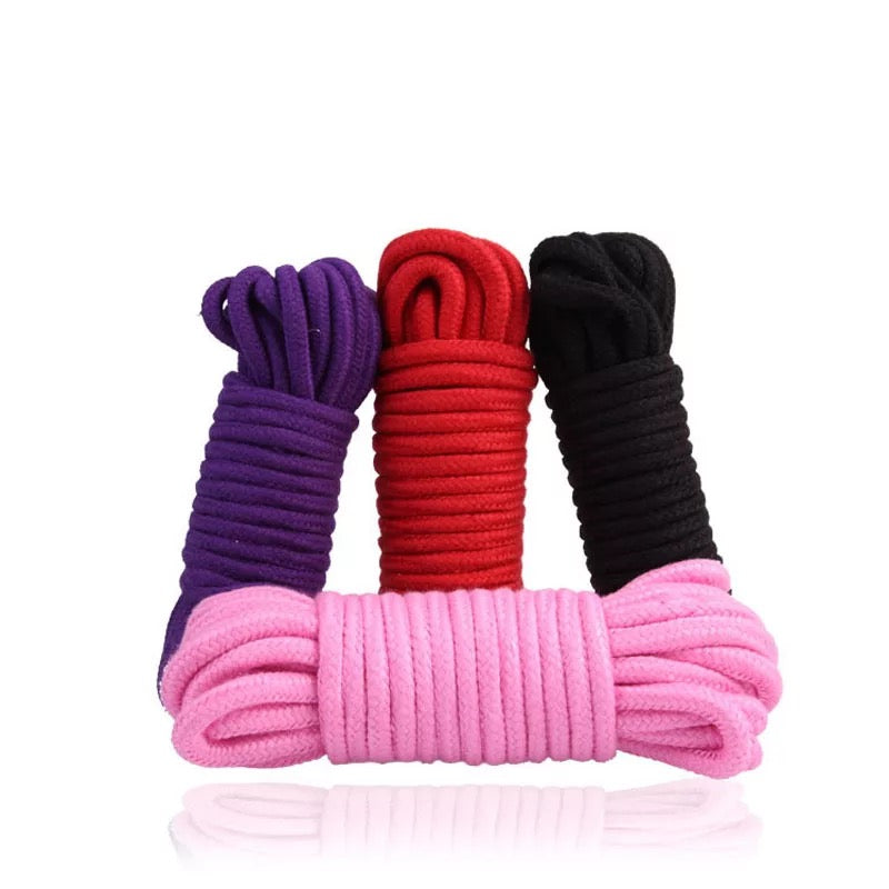 DDLGVERSE 5m Shibari rope, 4 pieces in purple (back left), red (back centre), black (back right) and pink (front centre)