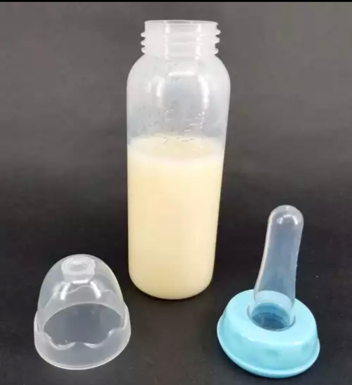 DDLGVERSE adult sized baby bottle with teat and blue cap
