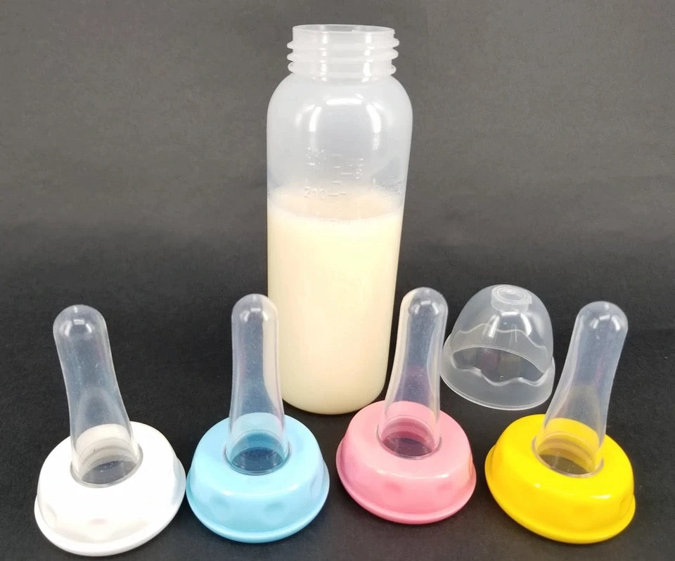DDLGVERSE Adult sized bottle with nipples, one bottle showing 4 coloured nipple options (from left to right) white, blue, pink and yellow