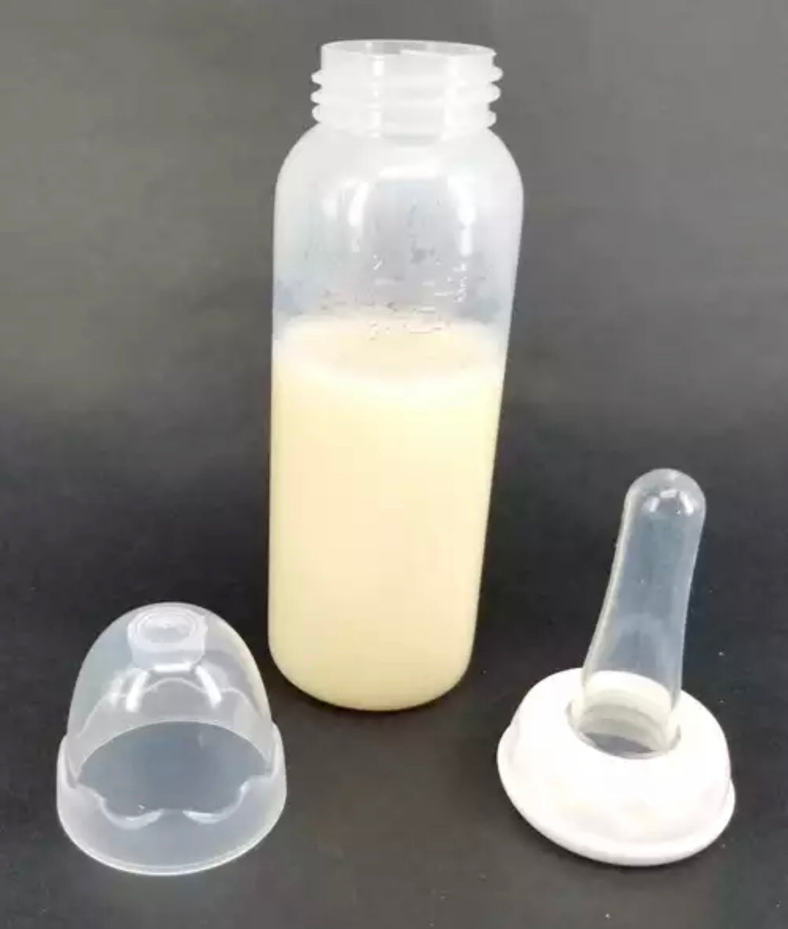 DDLGVERSE adult sized baby bottle with teat and white cap